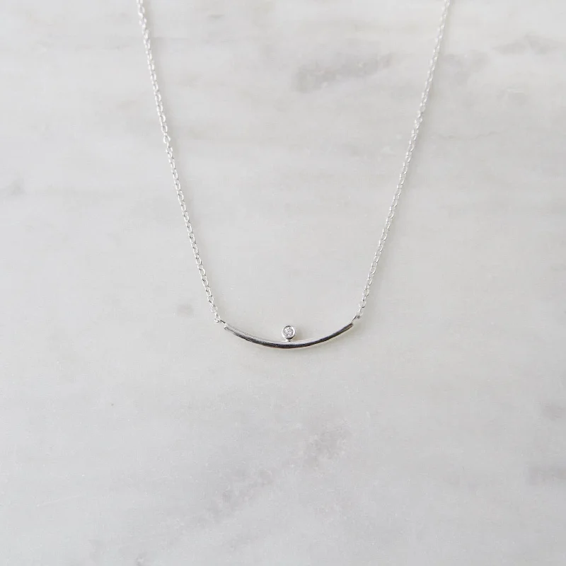 Curved bar necklace with bezel set CZ